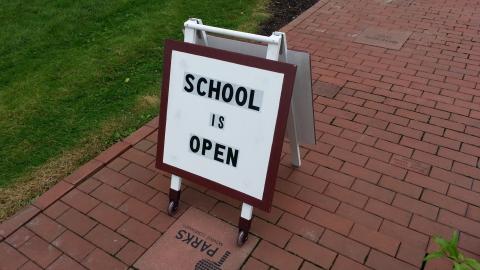 3D printed wheel adapters on the schoolhouse signs